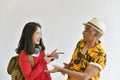 Family getting back together after time apart, Asian daughter say hi and glad to see elder old father.