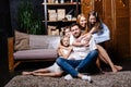 Family with gifts in front of Christmas tree Royalty Free Stock Photo