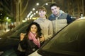 Family with girl posing near car outdoors in winter Royalty Free Stock Photo