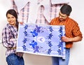 Family glues wallpaper at home. Royalty Free Stock Photo