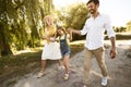 Family Going On Picnic Having Fun Walking Near Riverbank Outside Royalty Free Stock Photo