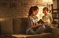 Family before going to bed mother reads to her child daughter bo Royalty Free Stock Photo