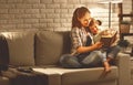 Family before going to bed mother reads to her child daughter bo Royalty Free Stock Photo