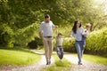 Family Going For Walk In Summer Countryside Royalty Free Stock Photo