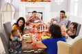 Family With Grandparents Enjoying Thanksgiving Meal At Table Royalty Free Stock Photo