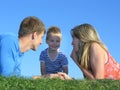 Family on grass faces Royalty Free Stock Photo