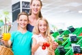 Family grocery shopping in corner shop Royalty Free Stock Photo