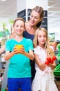 Family grocery shopping in corner shop Royalty Free Stock Photo