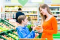 Family grocery shopping in hypermarket Royalty Free Stock Photo