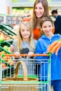 Family grocery shopping in hypermarket Royalty Free Stock Photo