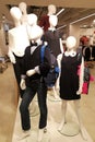 Family group of multiple mannequins include adult children white heads