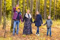 Family Group Relaxing Outdoors In Autumn Landscape Royalty Free Stock Photo