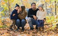 Family Group Relaxing Outdoors In Autumn Landscape Royalty Free Stock Photo