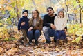 Family Group Relaxing Outdoors In Autumn Landscape Royalty Free Stock Photo