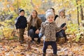 Family Group Relaxing Outdoors In Autumn Landscape Royalty Free Stock Photo