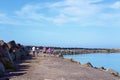 Family Group Walking Along A Marina Breakwater Royalty Free Stock Photo