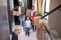 Family in the hall of their home with their dog