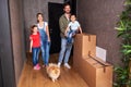 Family in the hall of their new apartment