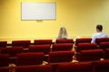 Family in hall is waiting start of showtime Royalty Free Stock Photo