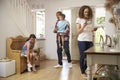 Family In Hallway Returning Home Together Royalty Free Stock Photo