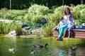 Family happiness Happy mother tenderly embracing his two sons children on grass in spring day, warm feelings of the , lifestyle mo Royalty Free Stock Photo