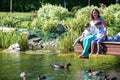 Family happiness Happy mother tenderly embracing his two sons children on grass in spring day, warm feelings of the , lifestyle mo Royalty Free Stock Photo