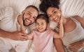 Family happy, child and above bed with parents in the morning, funny face in house and relax after sleeping together in Royalty Free Stock Photo