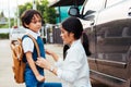 Family happy mother mom send children kid son boy kindergarten to school Royalty Free Stock Photo