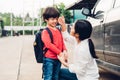 Family happy mother send children kid son boy kindergarten to sc Royalty Free Stock Photo