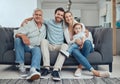 Family, happy portrait and relax on sofa in living room for quality time, relationship bonding and happiness together Royalty Free Stock Photo