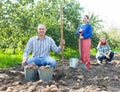 Family with harvested potatoes in field Royalty Free Stock Photo