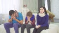 The family has a cold, mom dad and daughter sneeze sitting at home on the bed Royalty Free Stock Photo