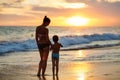 Family has fun at the seashore in summertime Royalty Free Stock Photo