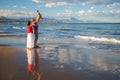 Family has fun at the seashore Royalty Free Stock Photo