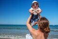 Family has fun at the seashore in summertime Royalty Free Stock Photo