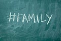 Family hashtag it handwritten with white chalk on a green blackboard Royalty Free Stock Photo