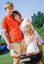 Family having barbecue outdoors Royalty Free Stock Photo