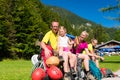 Family having break from hiking in the mountains Royalty Free Stock Photo