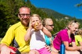 Family having break from hiking in the mountains Royalty Free Stock Photo