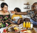 Family having breakfast in bed Royalty Free Stock Photo