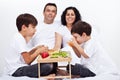 Family having breakfast in bed Royalty Free Stock Photo