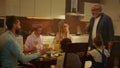 Family having dinner at home. Senior man making toast with glass of wine Royalty Free Stock Photo