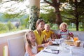 Family having dinner on outdoor patio Royalty Free Stock Photo