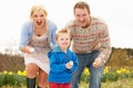 Family Having Egg And Spoon Race