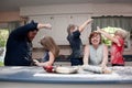 Family having food fight in kitchen Royalty Free Stock Photo