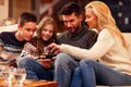 Family having fun on digital tablet for Christmas Royalty Free Stock Photo