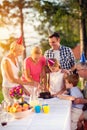 Family having fun while eating birthday cake Royalty Free Stock Photo