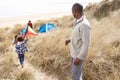 Family Having Fun With Kite In Sand Dunes Royalty Free Stock Photo