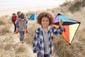 Family Having Fun With Kite In Sand Dunes Royalty Free Stock Photo