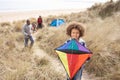 Family Having Fun With Kite In Sand Dunes Royalty Free Stock Photo